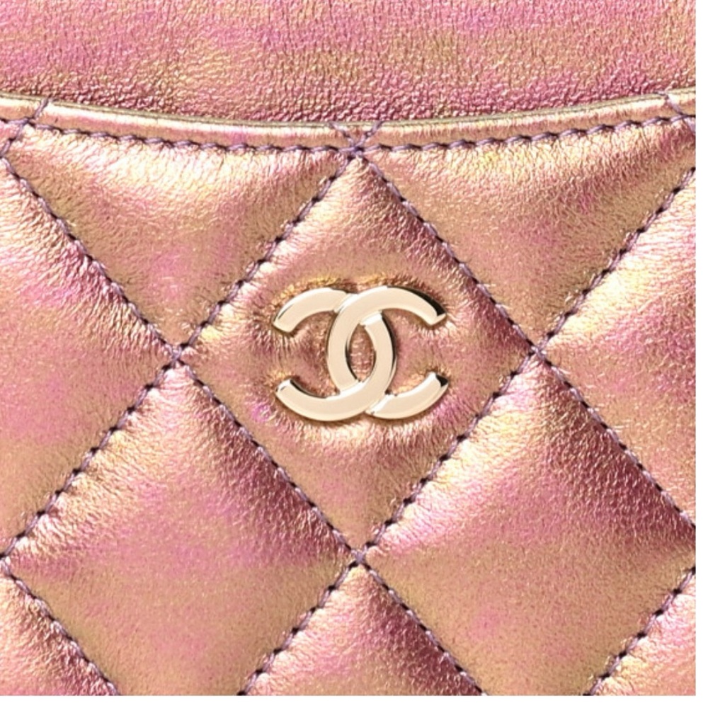 Authentic CHANEL Iridescent Lambskin Quilted Card Holder in purple.